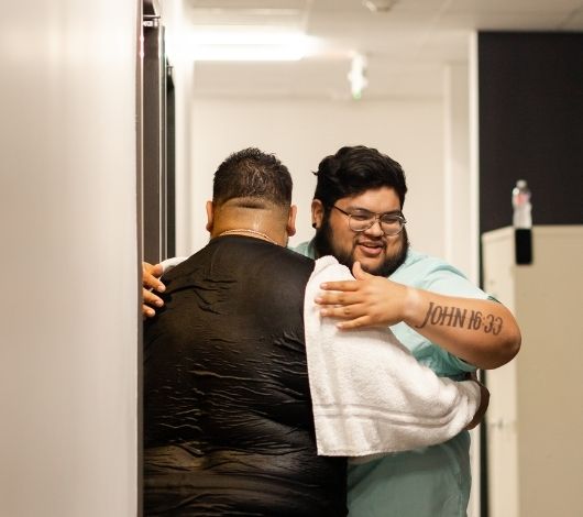 UC Baptism - hugging after baptism